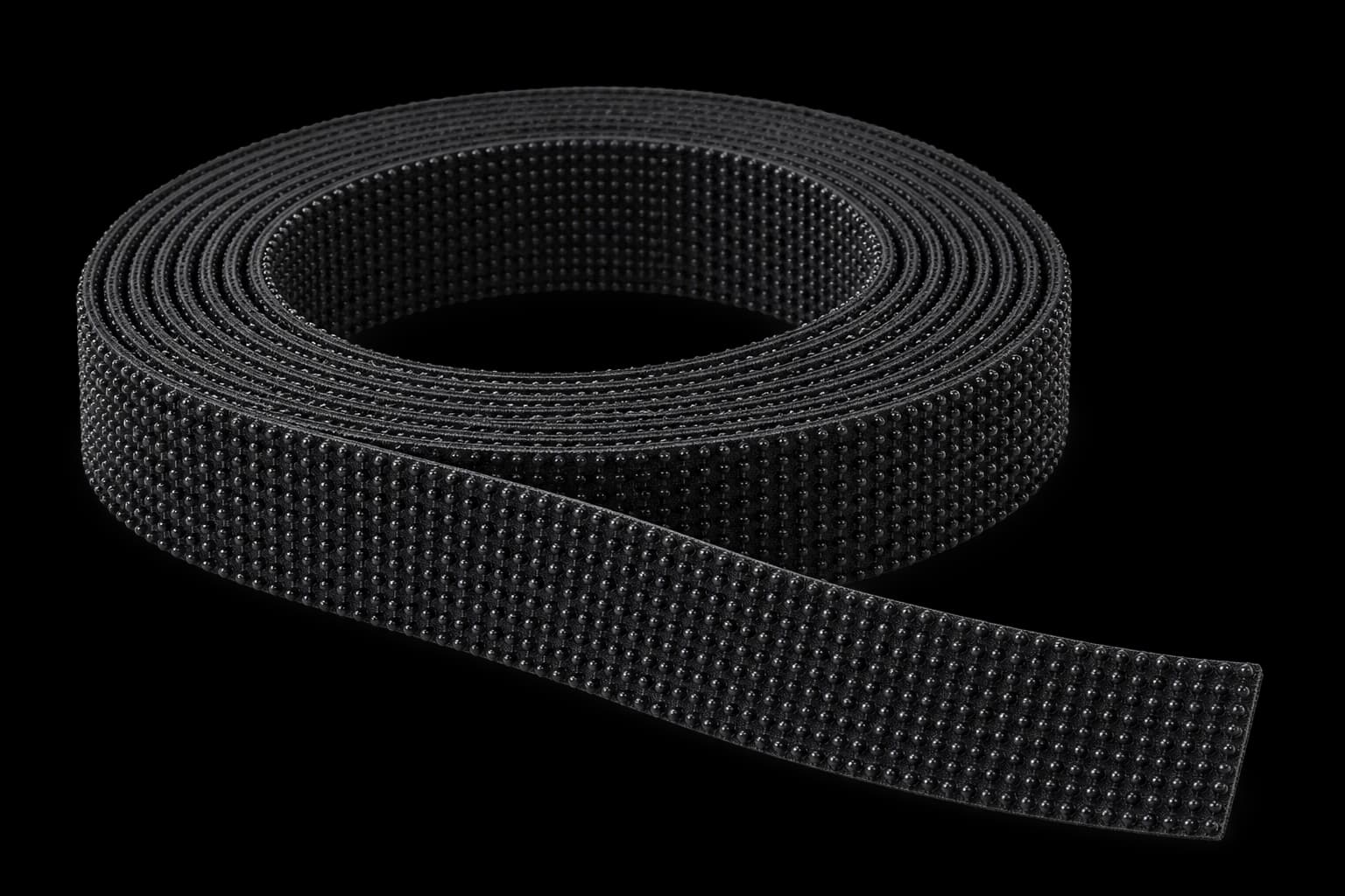 Illustrative roll of black mushroom-head reclosable fastener