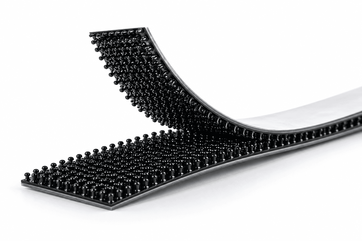 Illustrative black low-profile Dual Lock strips with fine self-mating mushroom heads