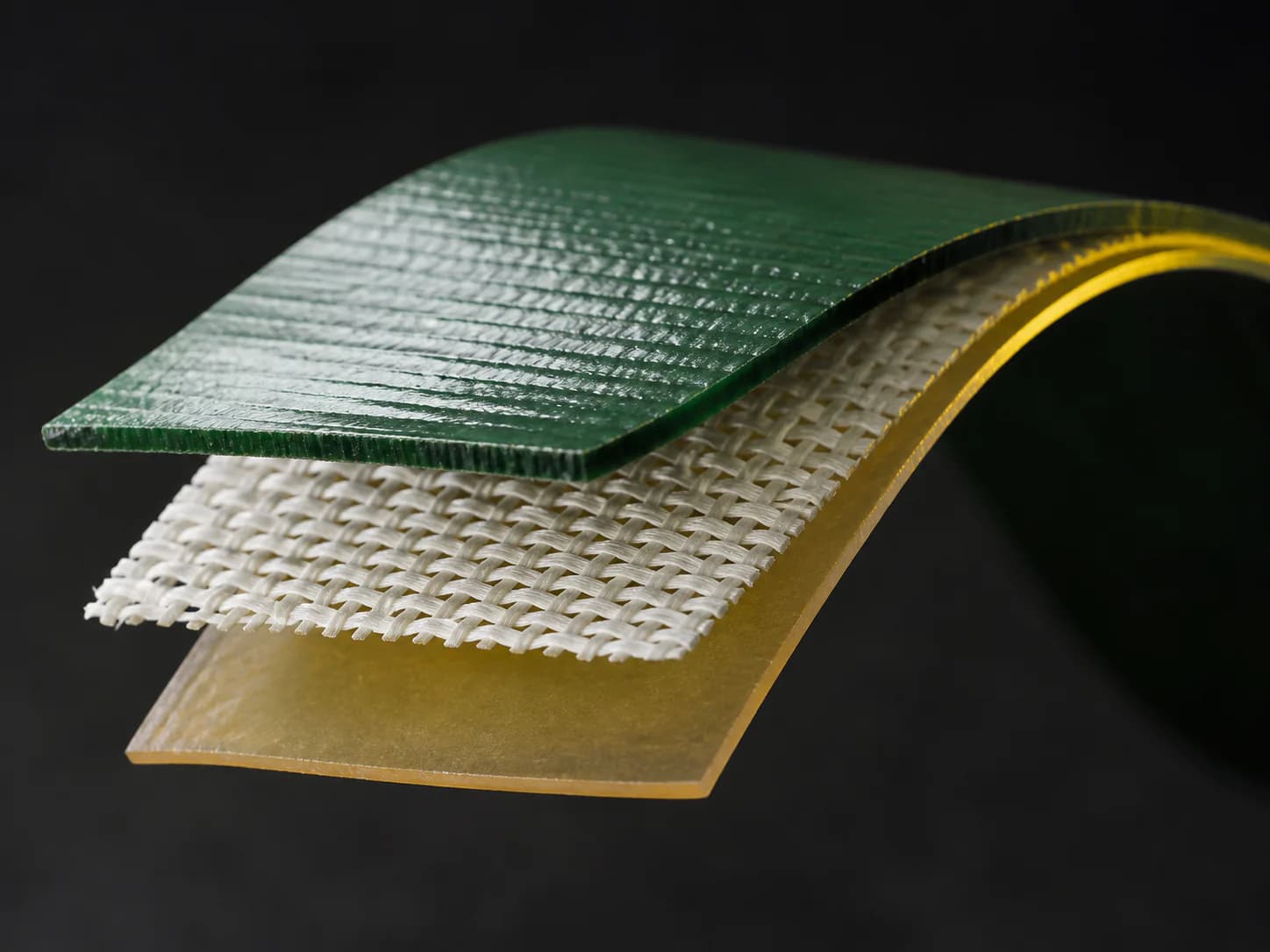 Layered duct tape construction with textile reinforcement